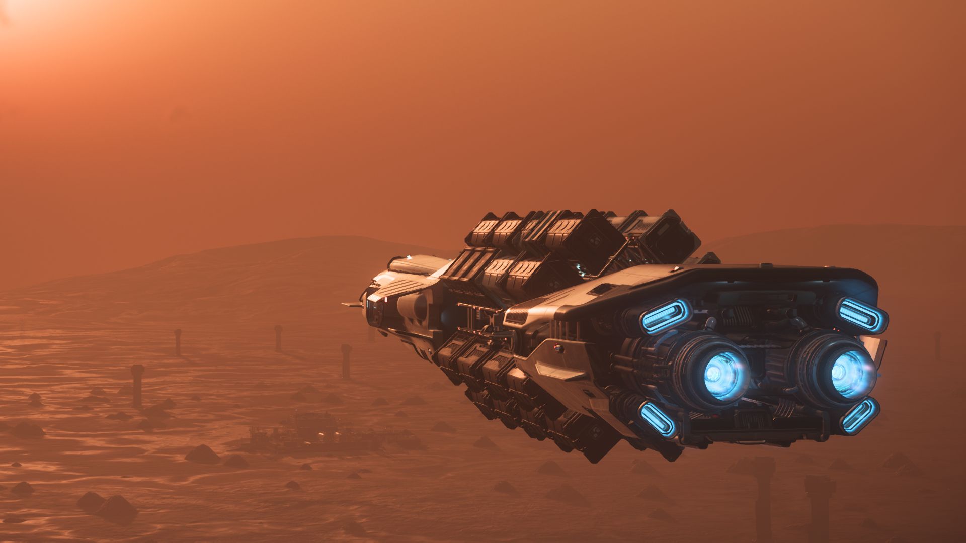 MISC Hull B du Transport de Codiga, cargaison arrimée sur ses racks extérieurs, en approche d’un avant-poste sur Daymar, organisation Star Citizen francophone.